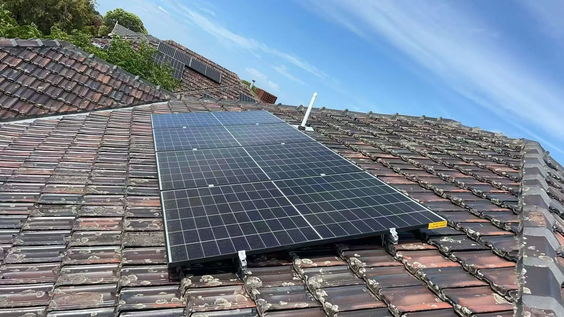 Residential 6.6 kW solar panels on tiled roof